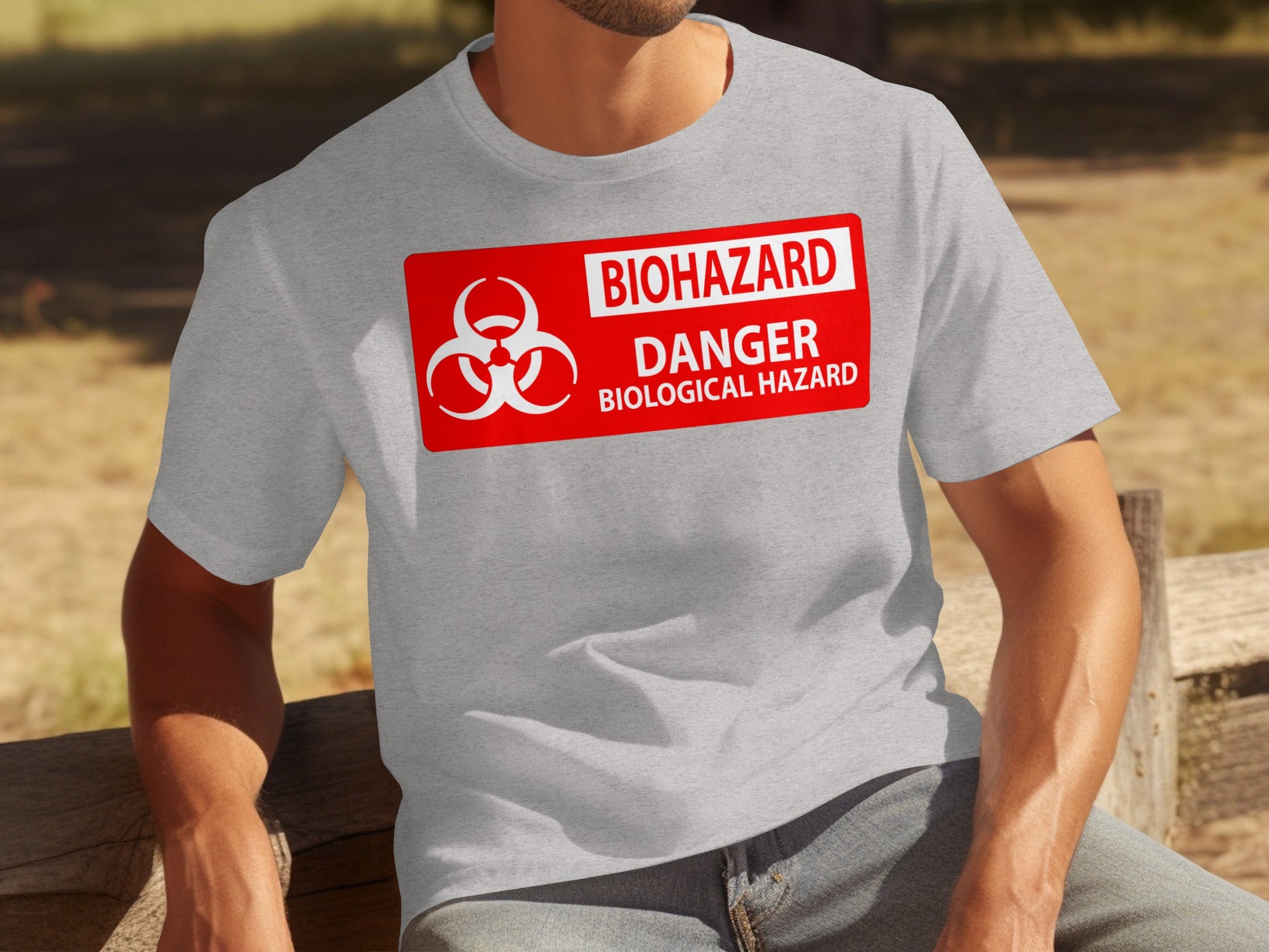 Grey t-shirt with a red biohazard danger biological hazard warning sign on the chest.