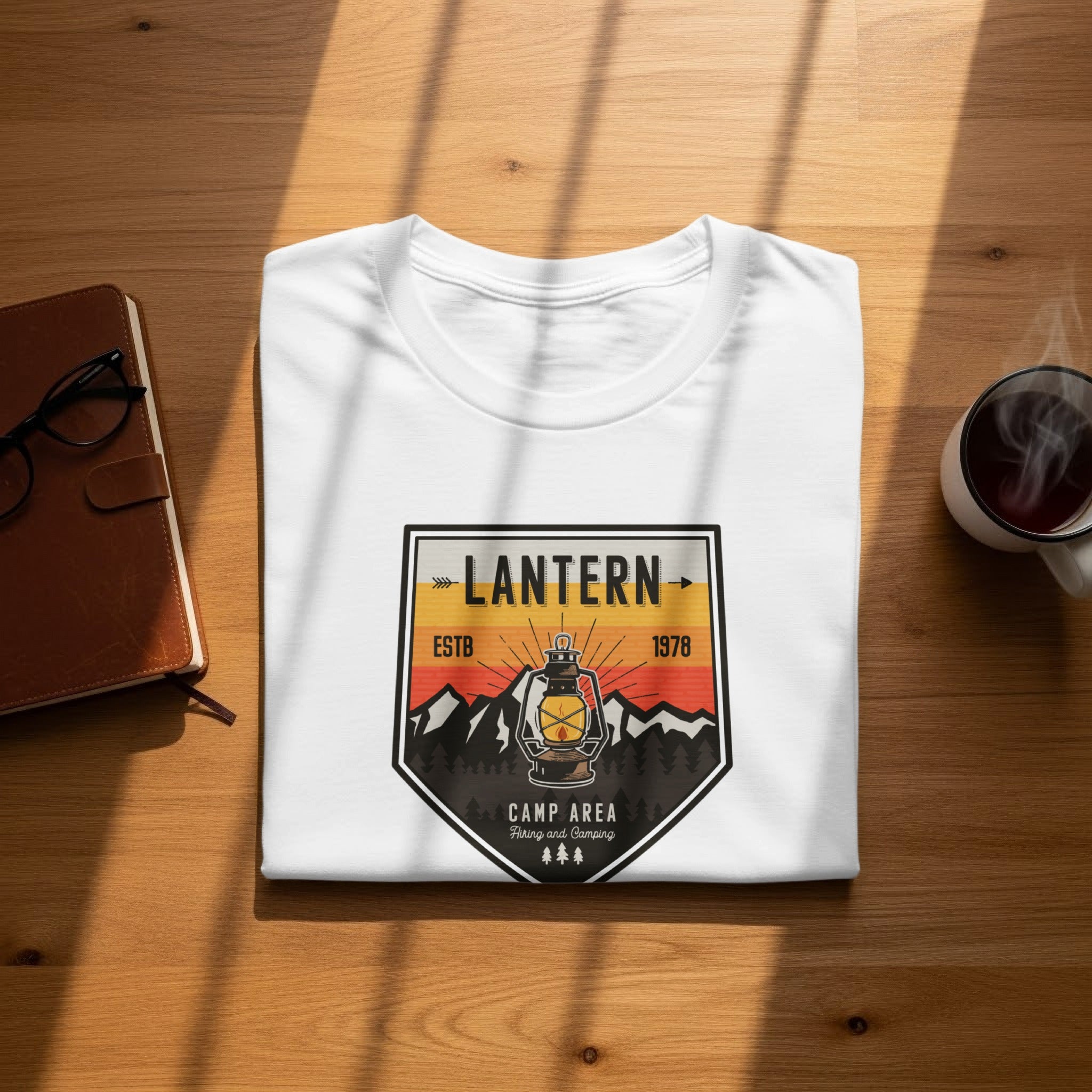 White t-shirt with "LANTERN" and camping graphic featuring a lantern.