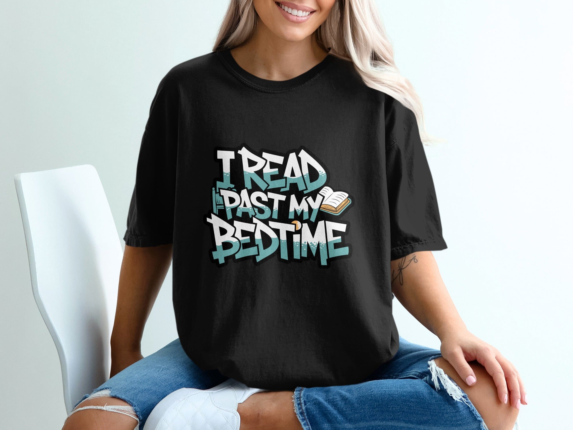 Black t-shirt with "I READ PAST MY BEDTIME" text and a book graphic.