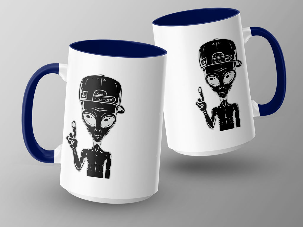 Two white mugs with blue handles and rims feature a black alien graphic.