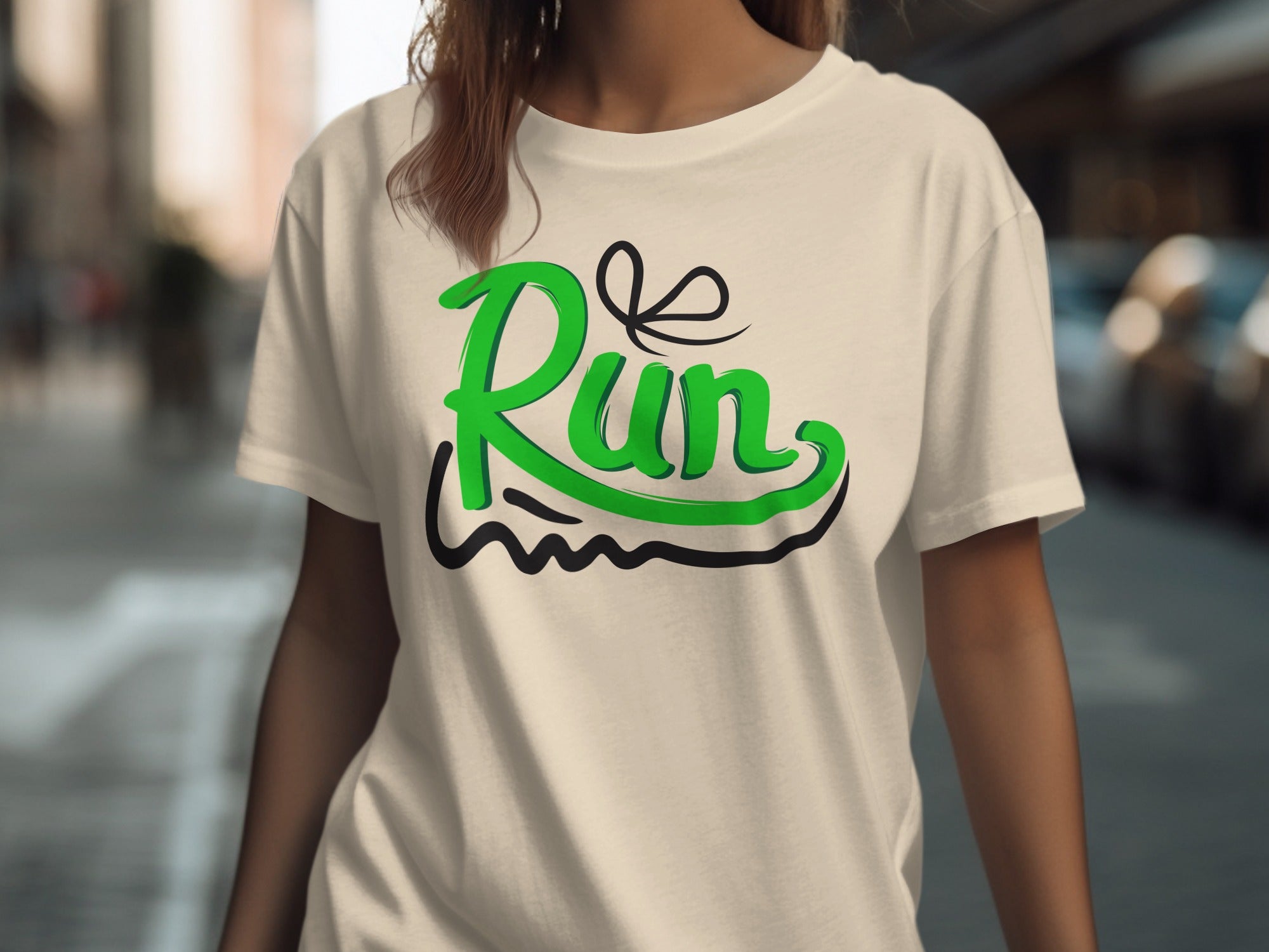 Cream t-shirt with a green "Run" graphic, featuring a black loop above the word.
