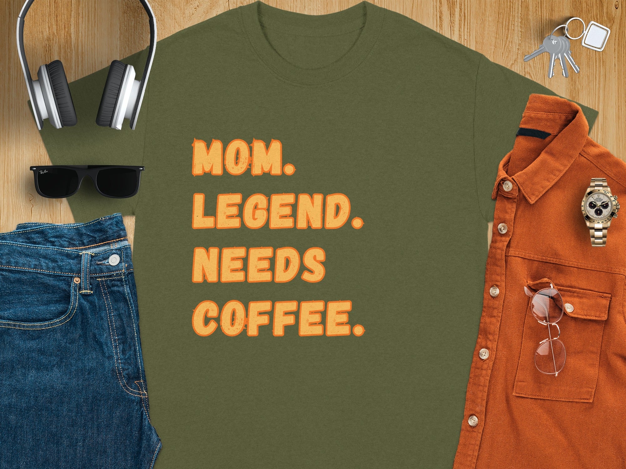 Green t-shirt with orange text reading "MOM. LEGEND. NEEDS COFFEE."