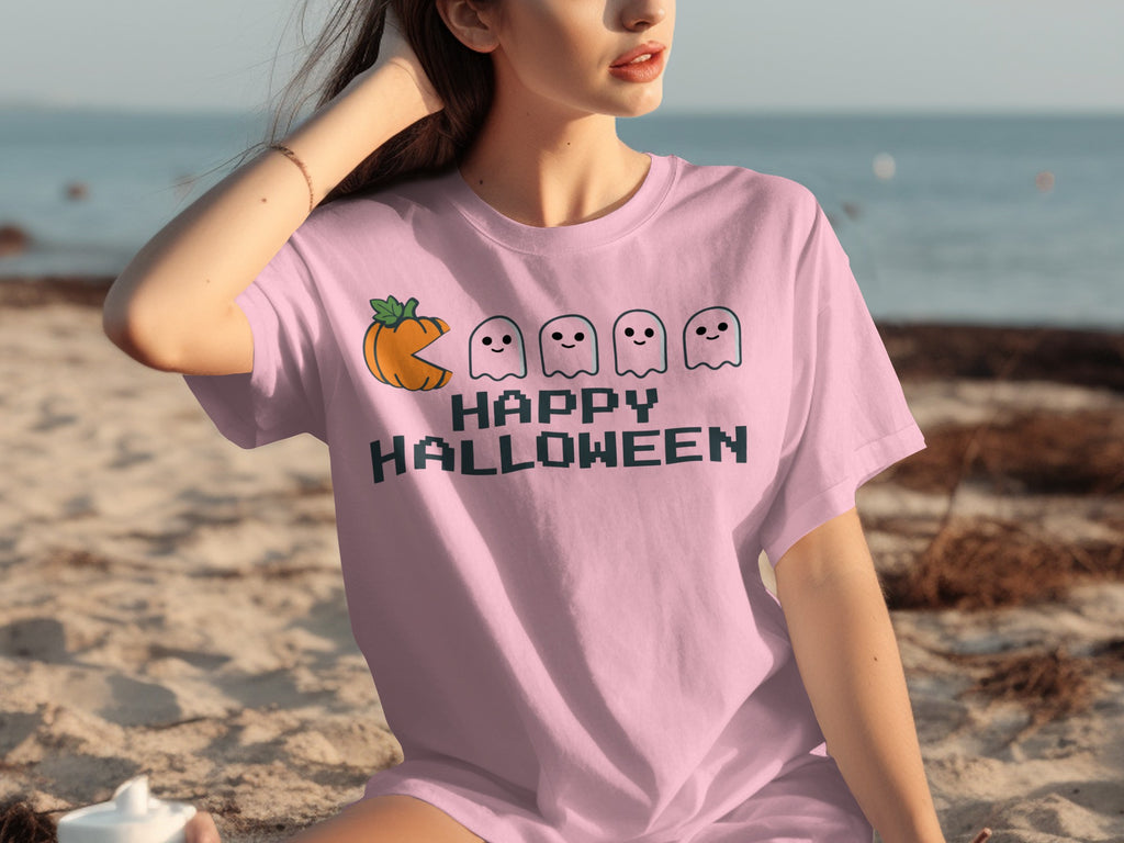 Pink t-shirt with a pixelated pumpkin, ghosts, and "Happy Halloween" text.
