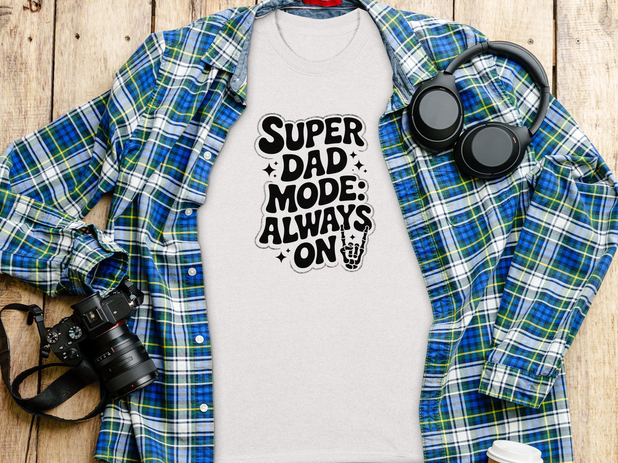 White t-shirt with "Super Dad Mode: Always On" text and skeleton hand graphic.