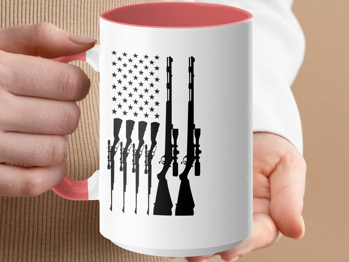 White mug with American flag design featuring rifle silhouettes.