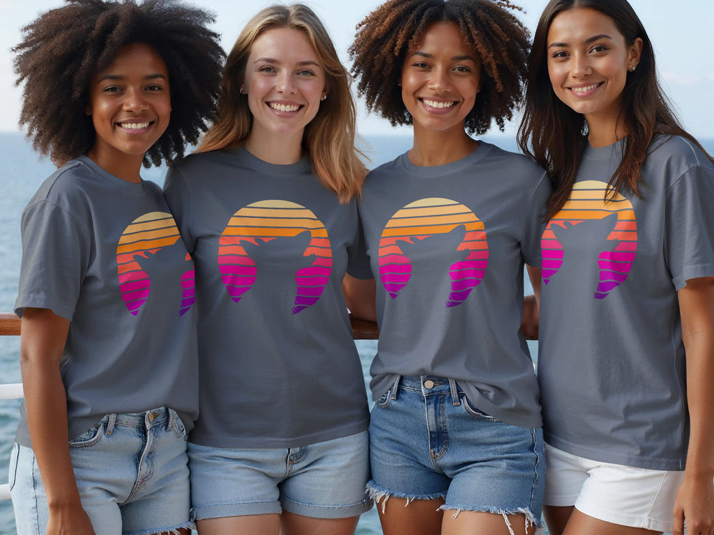 Four young women wear gray t-shirts with a sunset graphic of a wolf in outline.