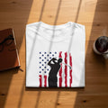 White t-shirt with a black golfer silhouette against an American flag design.