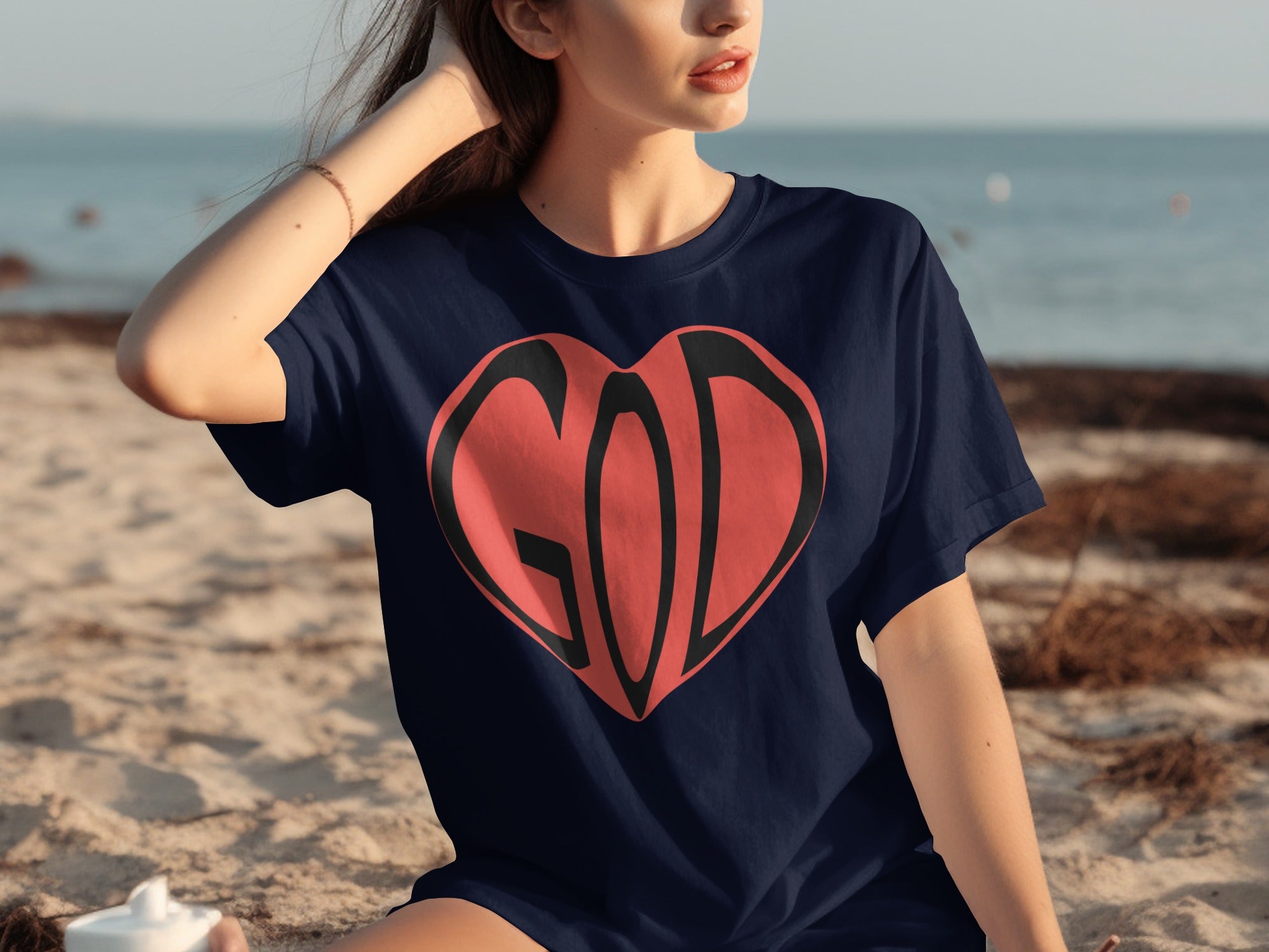 Navy t-shirt with red heart graphic and "GOD" text.