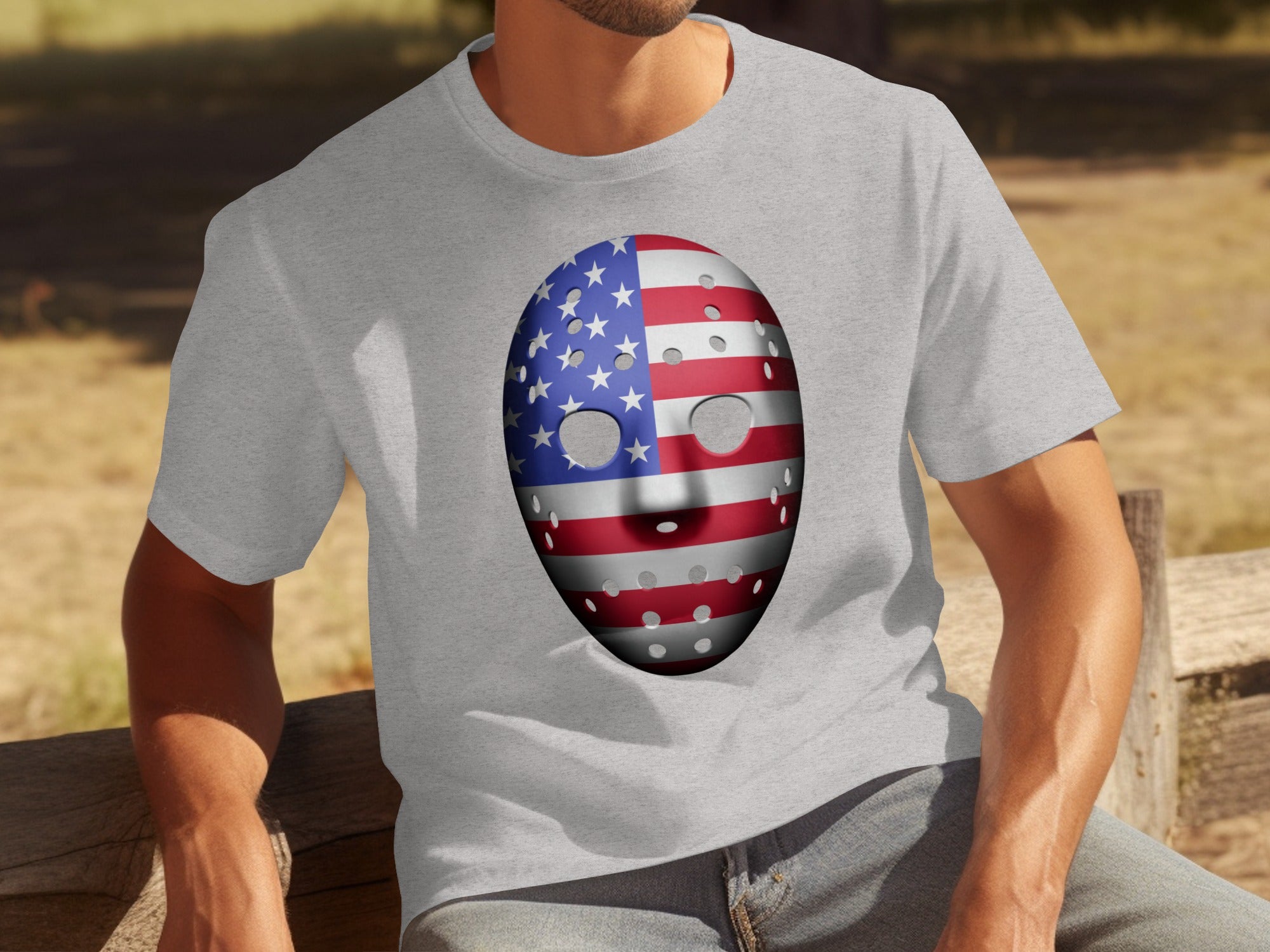 Grey t-shirt with a hockey mask printed with the American flag.