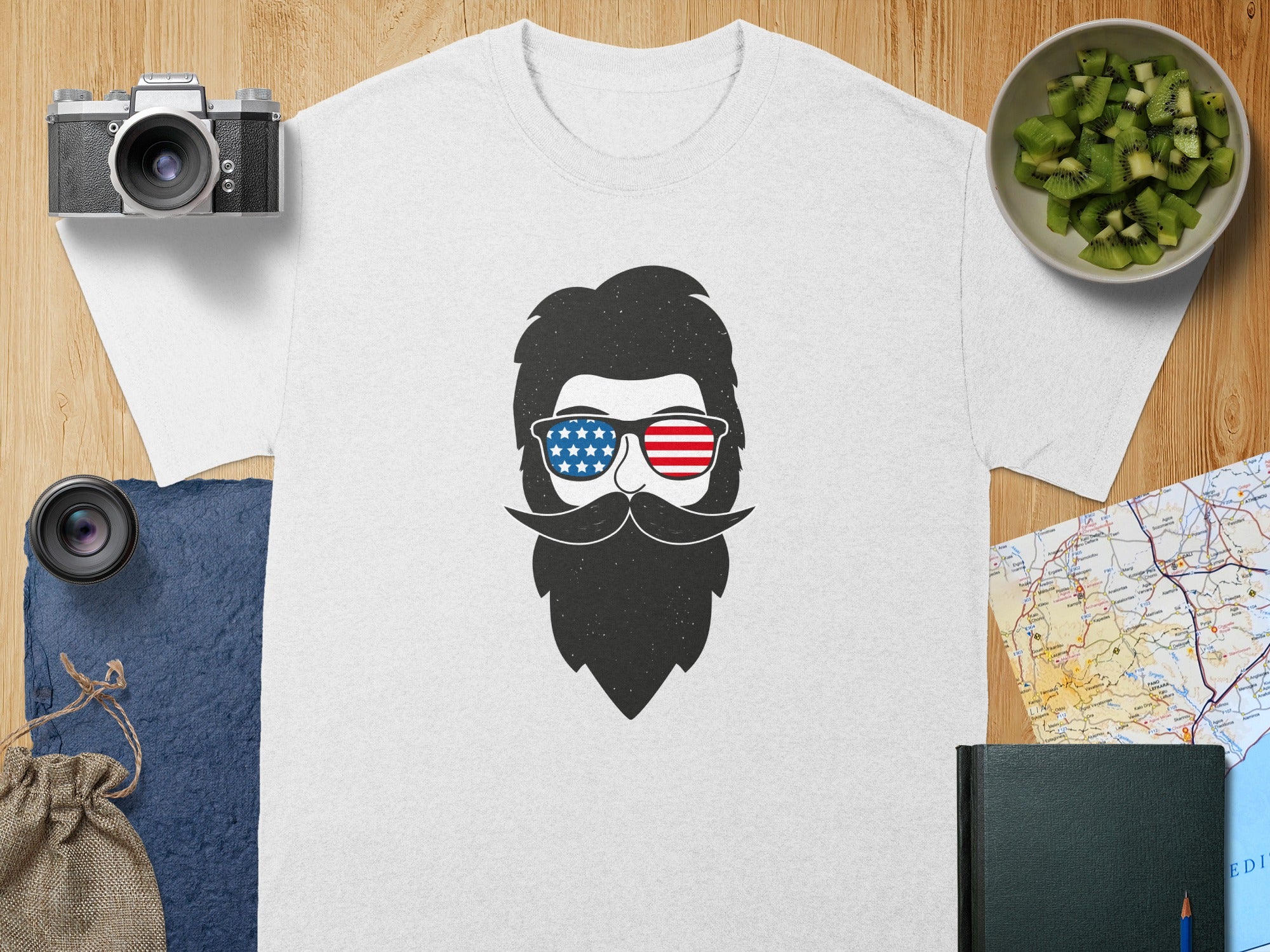White t-shirt with graphic of man with beard, mustache, and American flag sunglasses.
