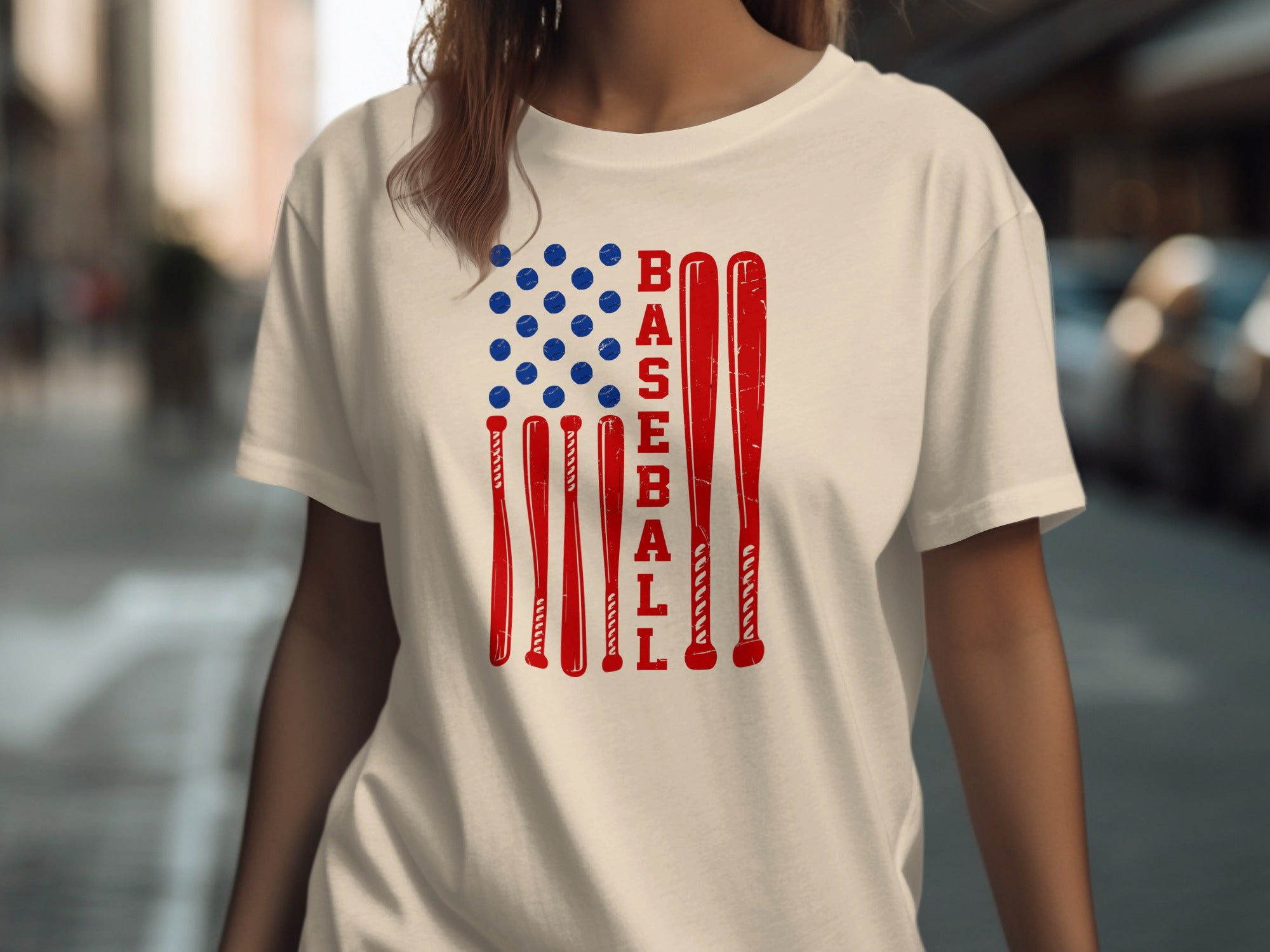 Cream t-shirt with a distressed American flag design made of baseball bats and balls.