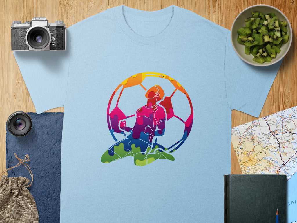Light blue t-shirt with a colorful graphic of a soccer player and ball.