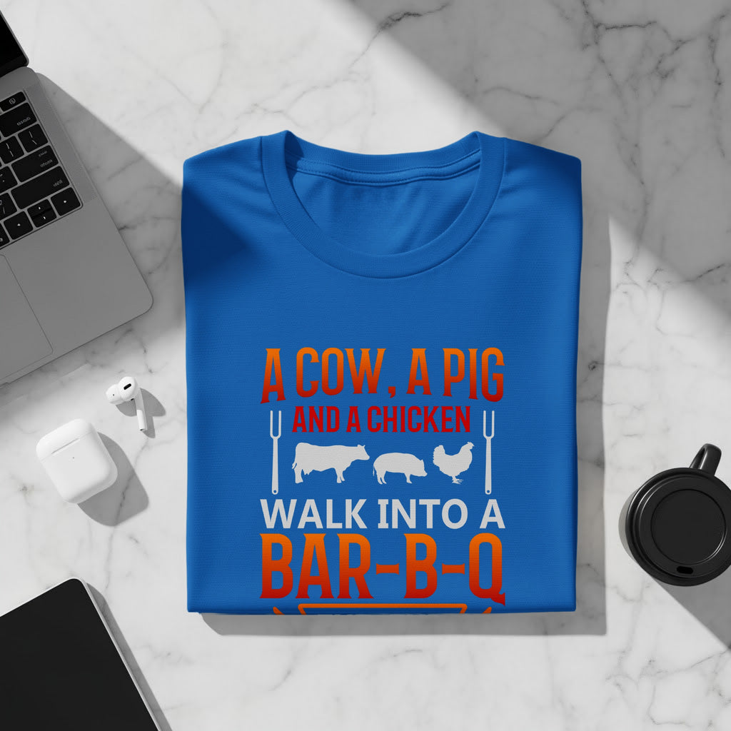 Blue t-shirt with text "A COW, A PIG AND A CHICKEN WALK INTO A BAR-B-Q".