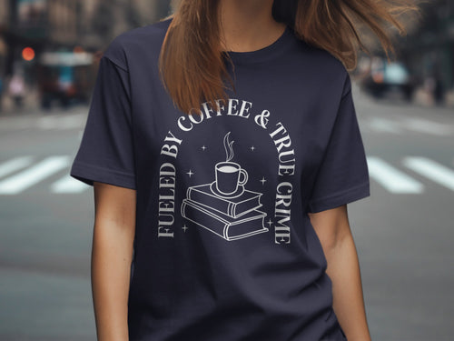 Navy t-shirt with "Fueled by Coffee & True Crime" text and a coffee cup on books graphic.