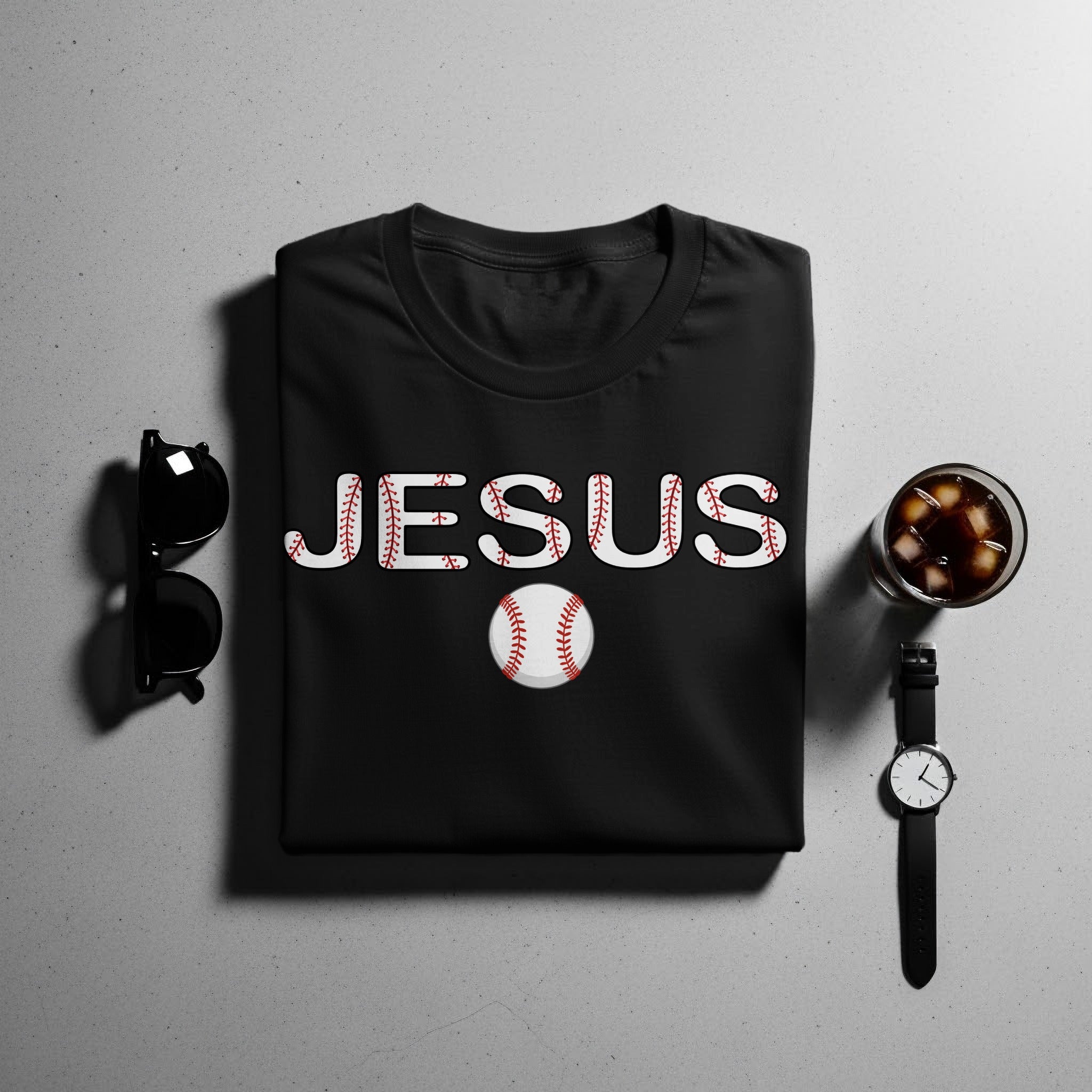 Black t-shirt with white "JESUS" text and baseball graphic.